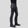 Side view of model wearing tight leather trousers